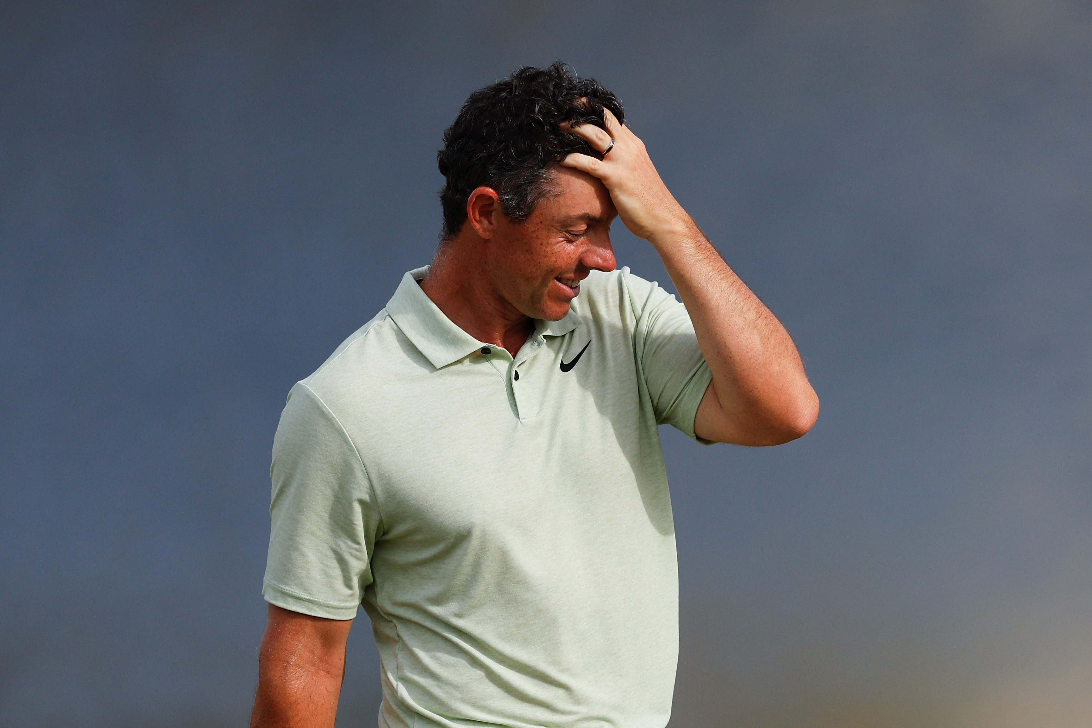 Rory McIlroy of Northern Ireland reacts as he walks off the 18th hole after finishing the final round of the Arnold Palmer Invitational with a 4-over par 76 March 10 in Orlando. (Photo by Mike Ehrmann/Getty Images)
