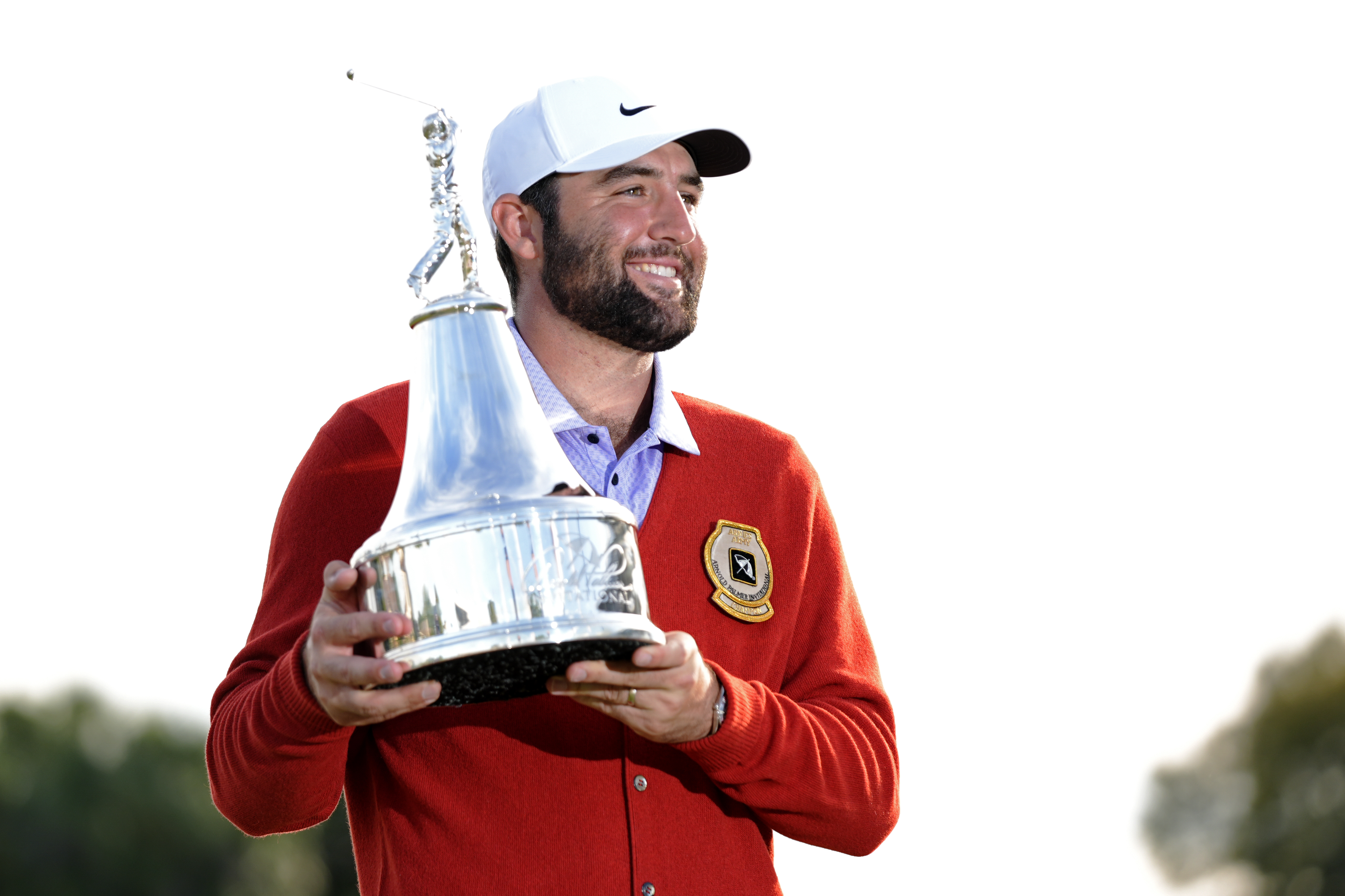 Scottie Scheffler holds the championship trophy after winning the 2024 Arnold Palmer Invitational March 10 at Bay Hill Club and Lodge in Orlando. (AP Photo/John Raoux)