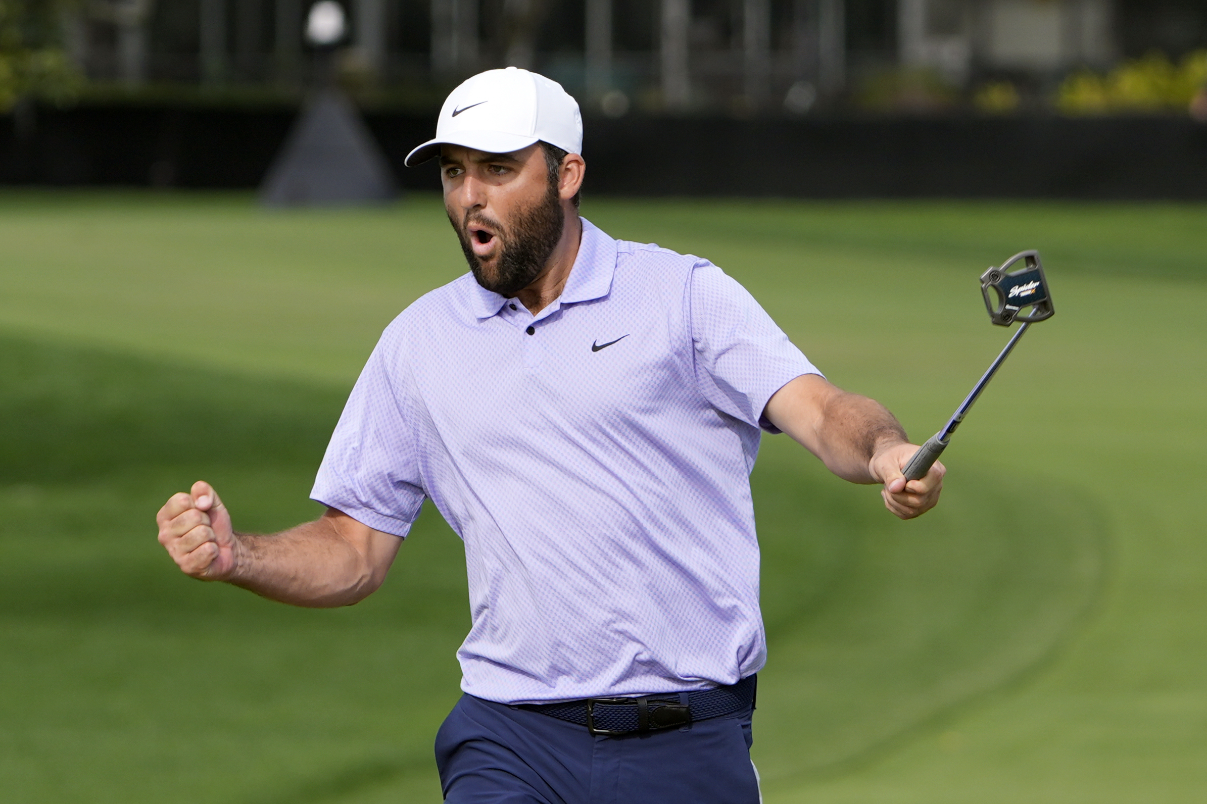 Scottie Scheffler celebrates after a 35-foot birdie putt on the 15th green during the final round of the Arnold Palmer Invitational March 10 at Bay Hill Club and Lodge in Orlando. (AP Photo/John Raoux)