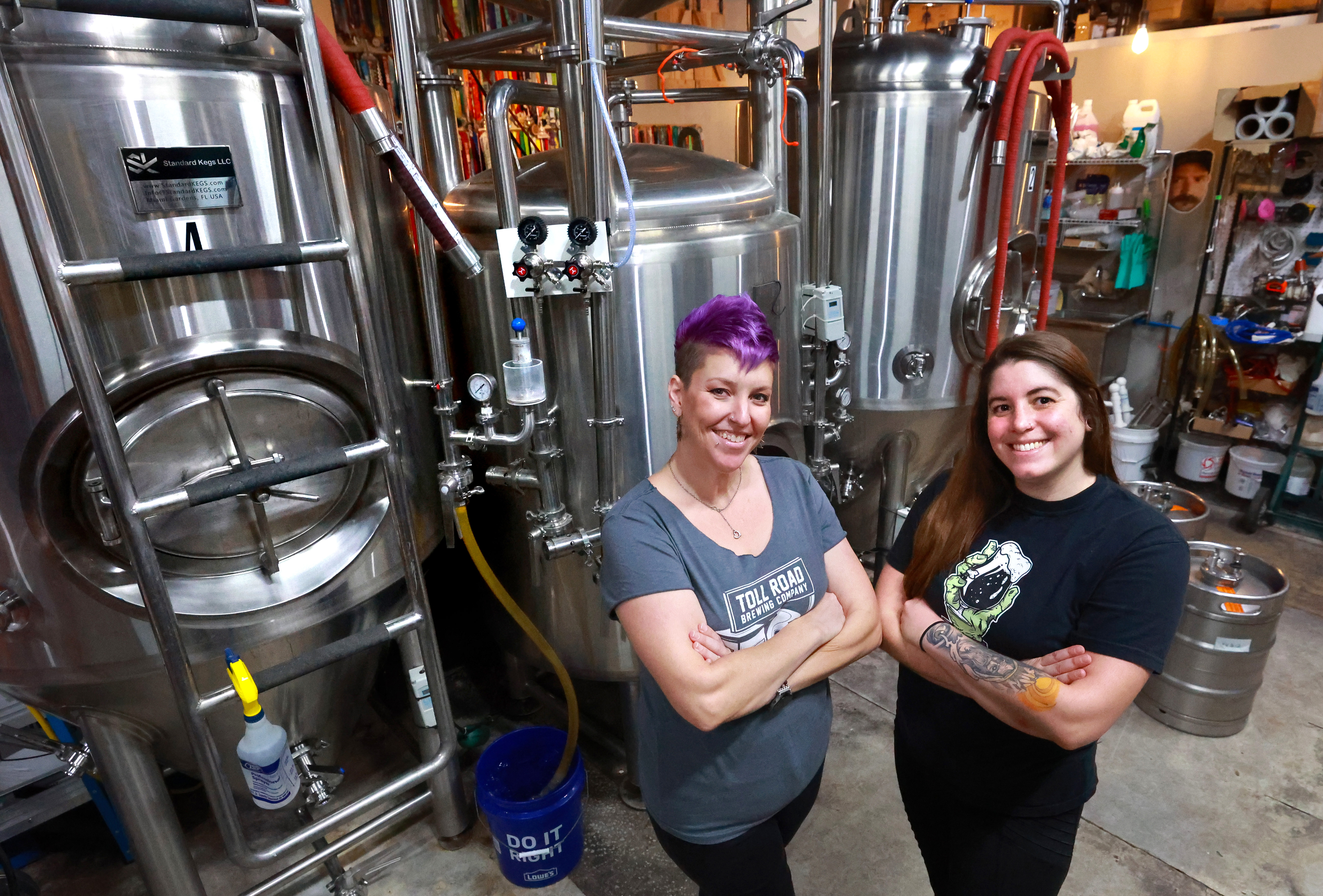 Heather Opheim of Deviant Wolfe Brewing, right, and Amanda Smythe from Tollroad Brewing in the brewhouse at Deviant Wolfe in downtown Sanford, Thursday, May 21, 2024. (Joe Burbank/Orlando Sentinel)