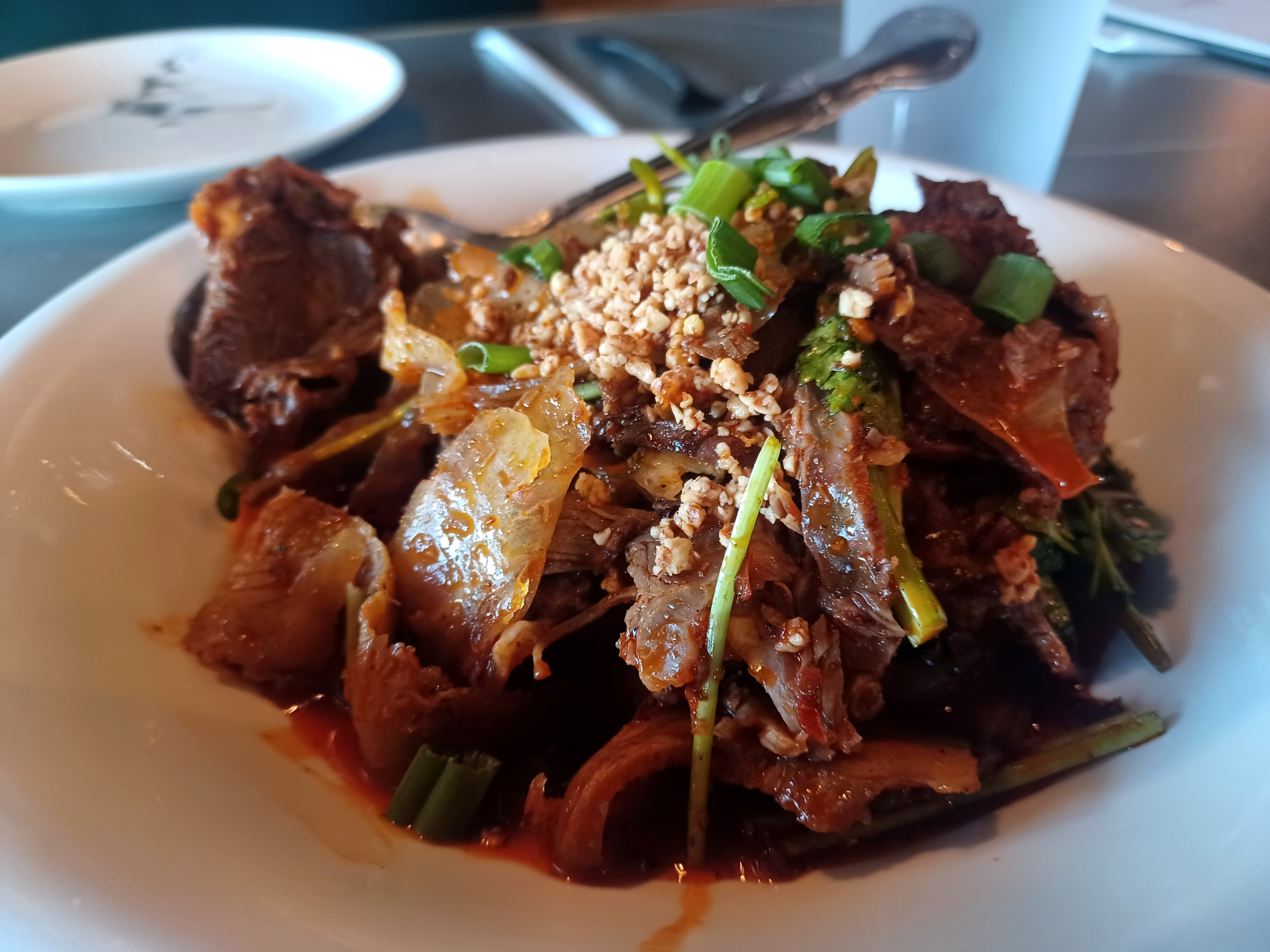 Sliced beef and ox tongue with chili sauce, layered with flavors heady and bright and textures slick, chewy and crunchy make for an addictive appetizer. (Amy Drew Thompson/Orlando Sentinel)