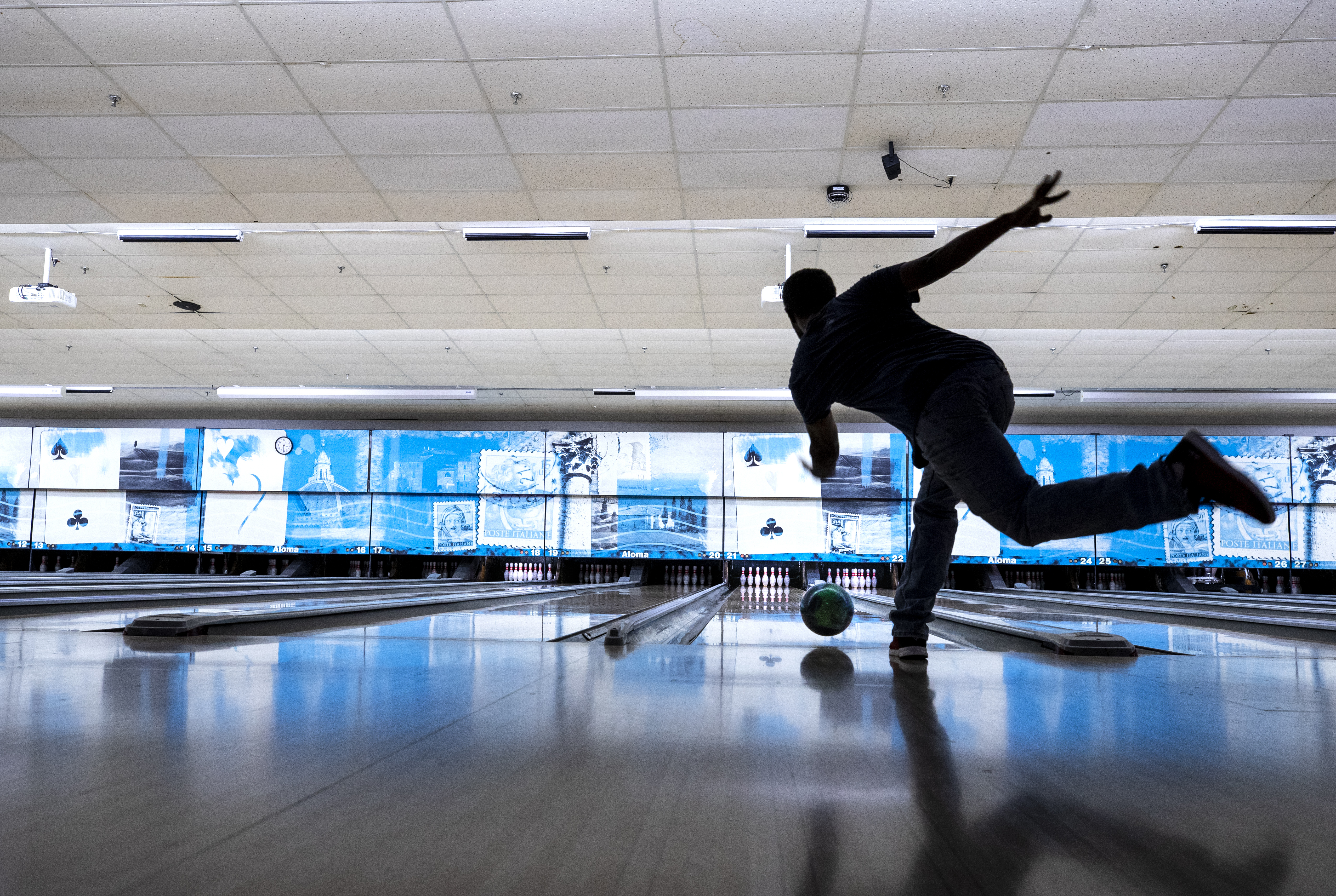 With practiced precision Clarence Jones throws his bowling ball down the alley as he warms up on a chilly fall day at Aloma Bowl in Winter Park on Wednesday Dec., 2, 2020. Jones and others spent a few hours in the warm confines of Aloma Bowl listening to 80's rock and rolling bowling balls down the alleys.(Willie J. Allen Jr./Orlando Sentinel)