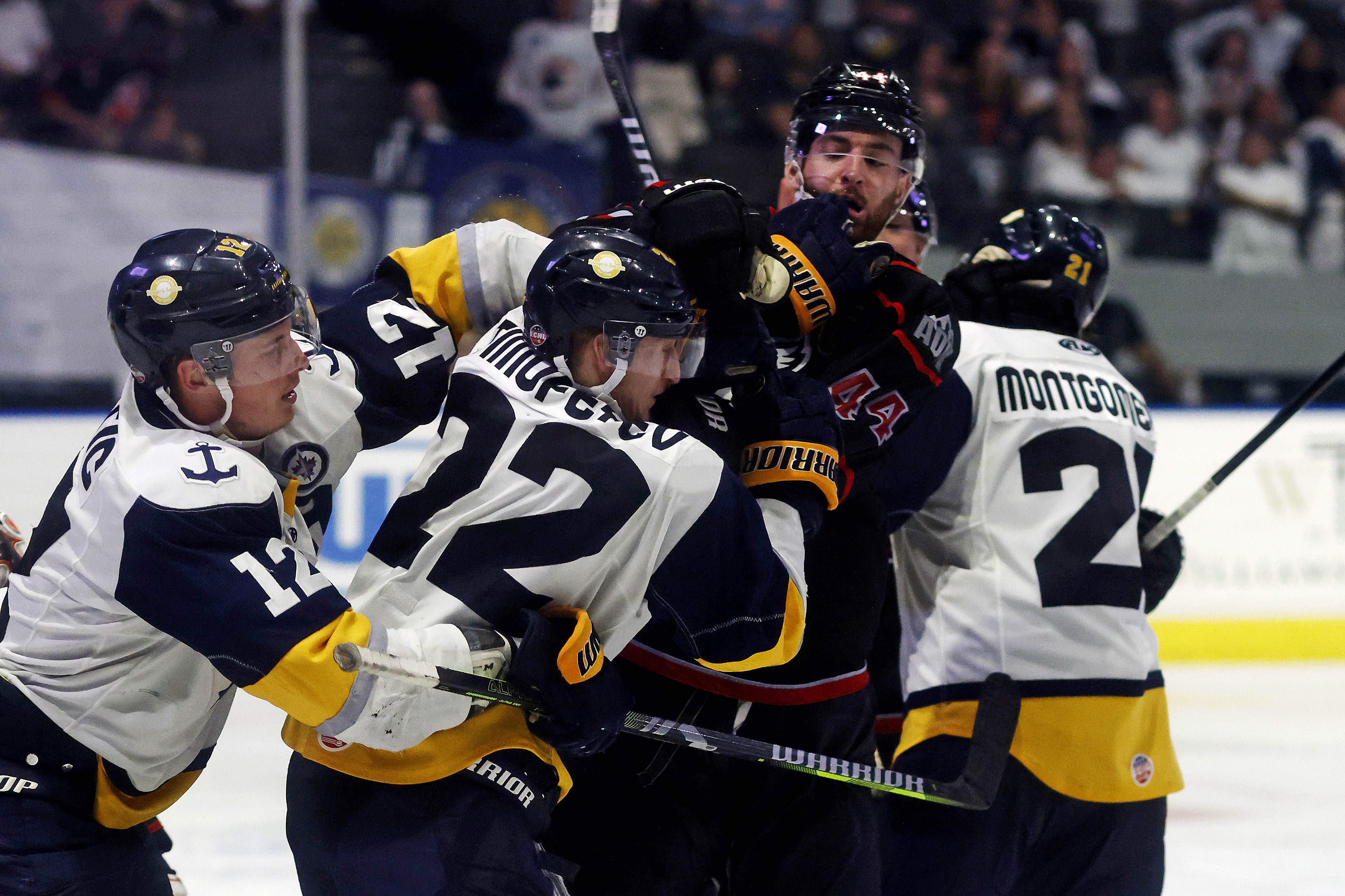 Stepan Timofeyev #22 of the Norfolk Admirals and Darian Skeoch #44 of the Adirondack Thunder start to fight during overtime of game 3 of the North Division Finals in the Kelly Cup Playoffs at the Scope in Norfolk, Va., May 8, 2024. The Norfolk Admirals lost 2-1 in overtime. (Peter Casey / For The Virginian-Pilot)