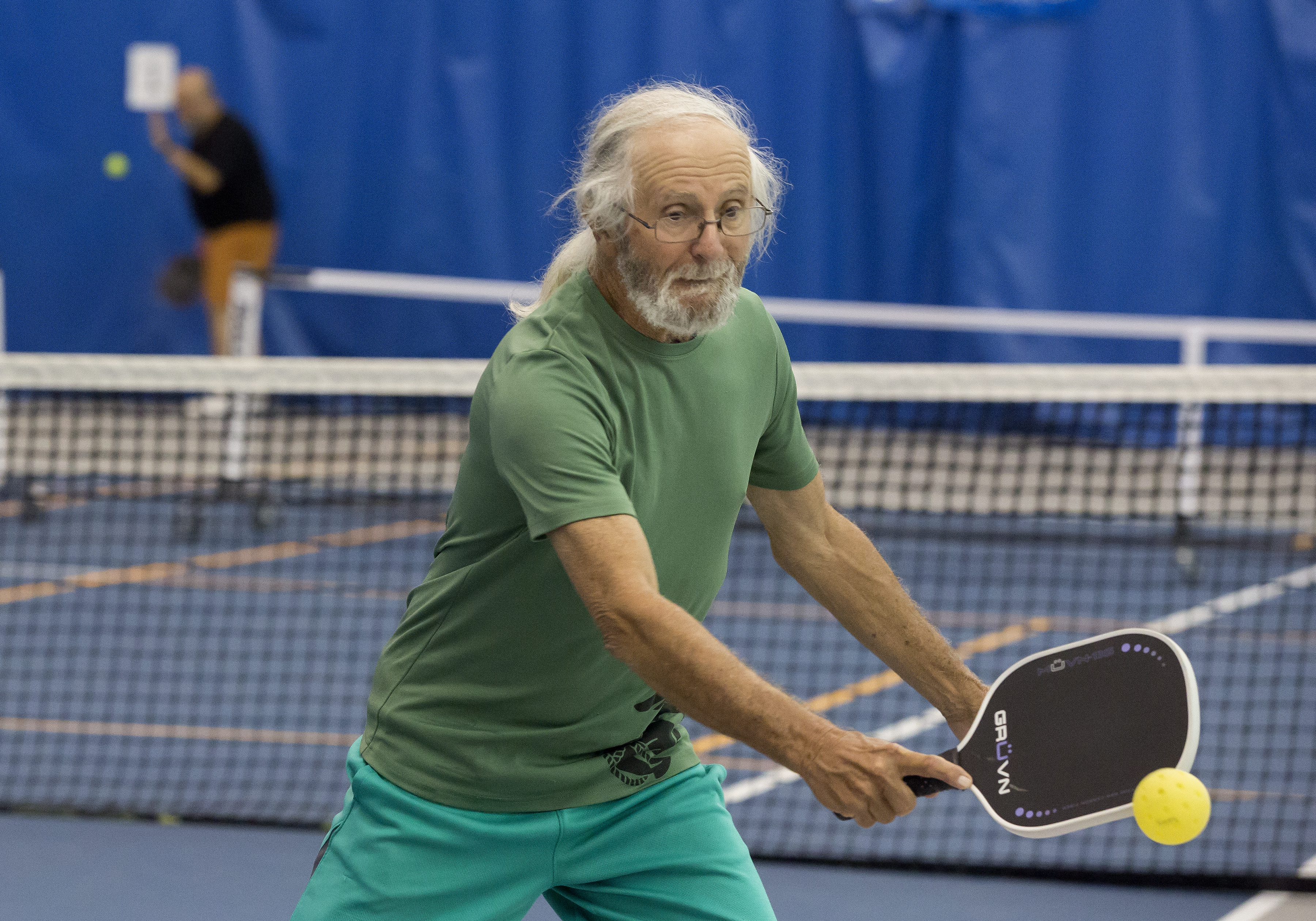 Joe Giovinozzo of Virginia Beach makes a return during a game of pickleball Tuesday morning, June 18,2024 at the Folkes-Stevens Indoor Tennis Center on the campus of Old Dominion University in Norfolk. Bill Tiernan/ For The Virginian-Pilot