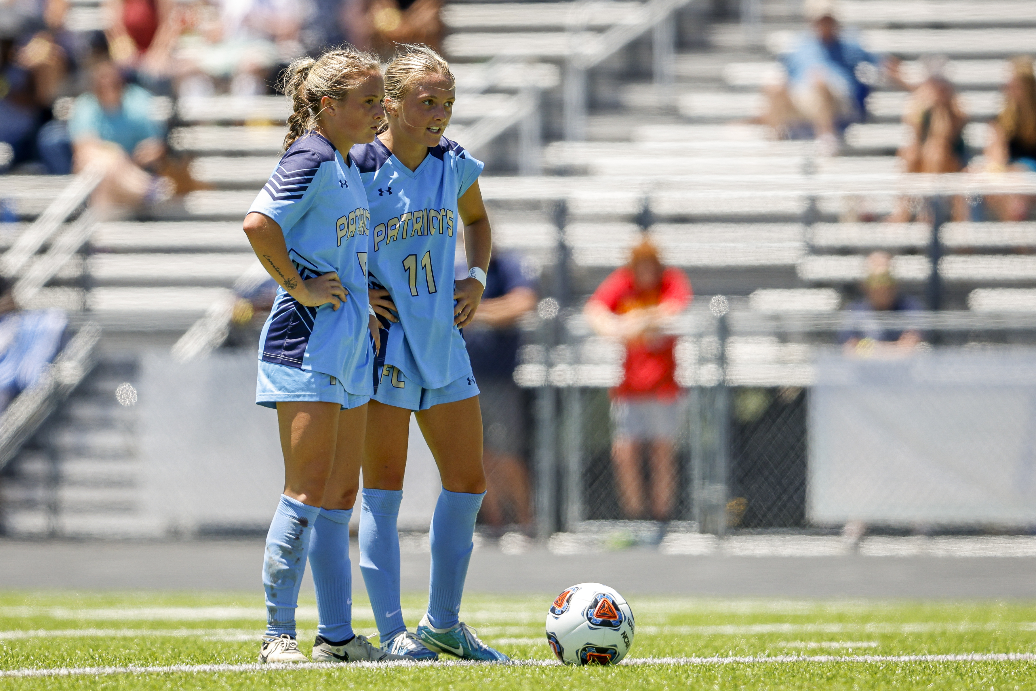 First Colonial players Skyler Miller (5), left, and Sydney Miller (11) prepare for a free-kick with less than ten minutes left in the game. First Colonial defeated Midlothian 3-2 in the class 5 soccer state semifinal at Glen Allen High School in Glen Allen, Virginia, on June 7, 2024. (Billy Schuerman / The Virginian-Pilot)