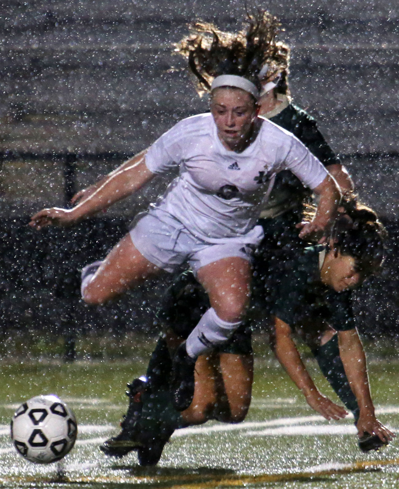 Kellam's Kaylee Kozlowski, front, defended by Cox's Reagan Feuerhahn, fights her way toward the goal during the first half of the game at Kellam on Tuesday, May 23, 2017.