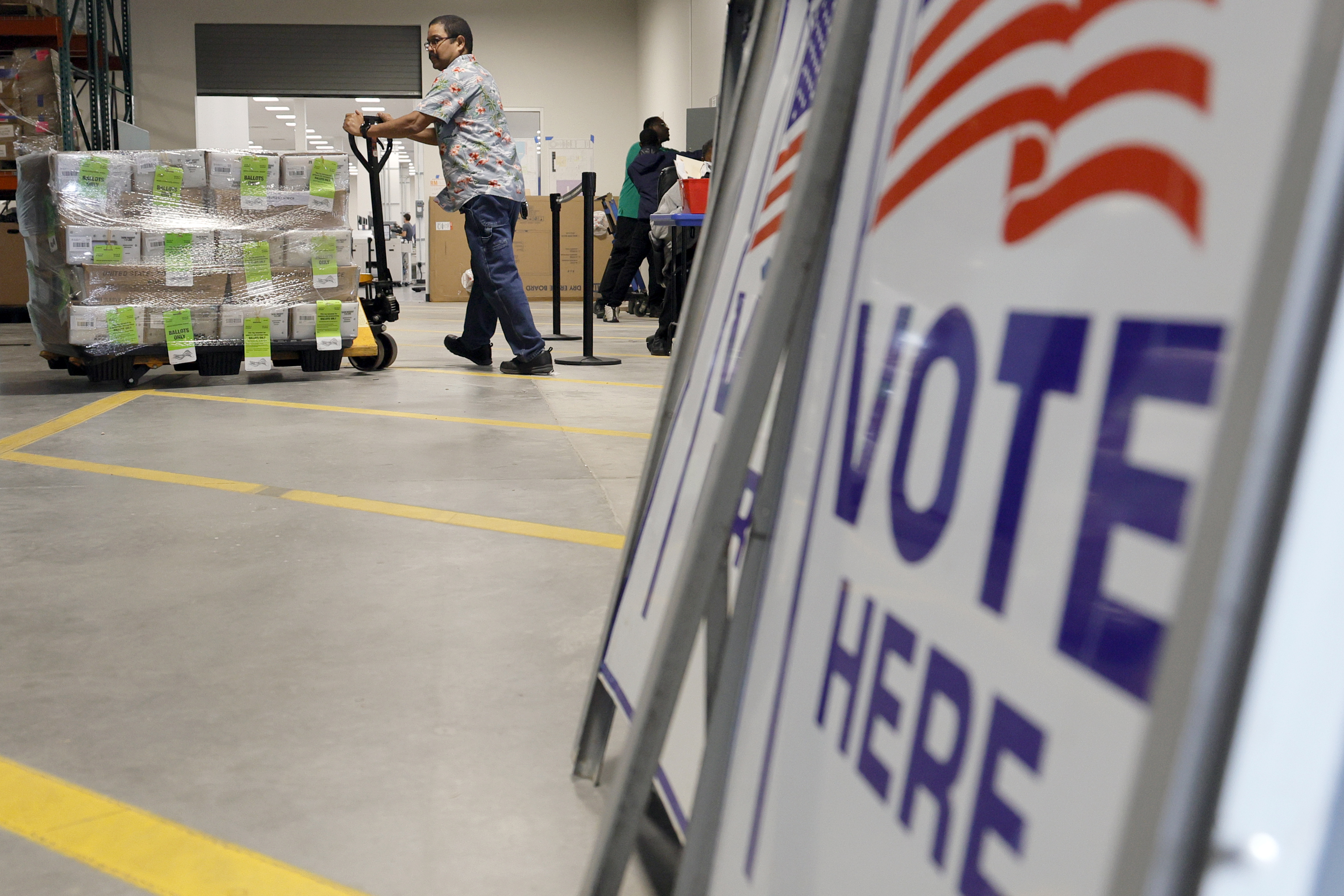 Christopher Foon pushes a pallet of mail ballots at the Palm Beach County Supervisor of Elections Office in West Palm Beach on Friday, July 12, 2024. The first batch of mail ballots, more than 150 thousand, were sent to voters in Palm Beach County. (Amy Beth Bennett / Sun Sentinel)