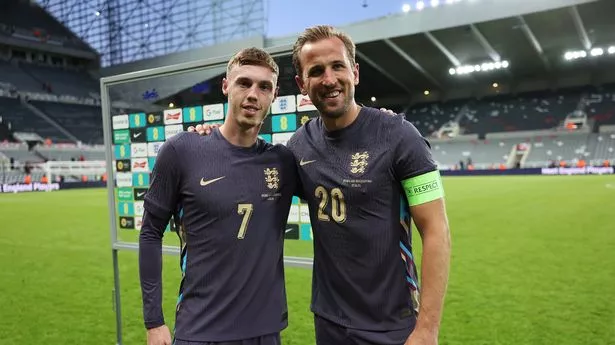Cole Palmer and Harry Kane of England pose for a photo
