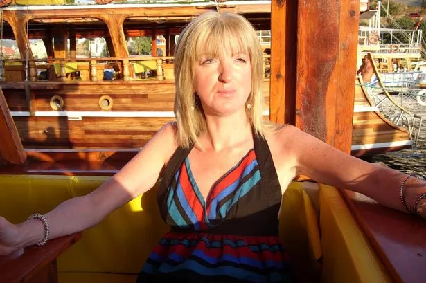 Bridgeen Mitchell sitting in the sun's glow outside