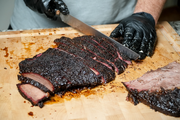 slicing a smoked brisket