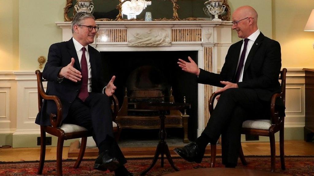 Sir Keir Starmer and John Swinney chatting in chairs 