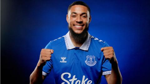 Arnaut Danjuma poses in an Everton shirt