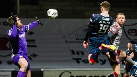 Arbroath and Raith players challenge for the ball