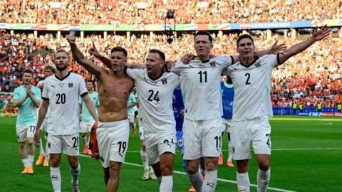 Austria players celebrate beating the Netherlands