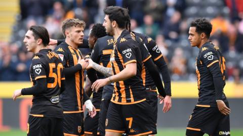 Hull players celebrate a goal