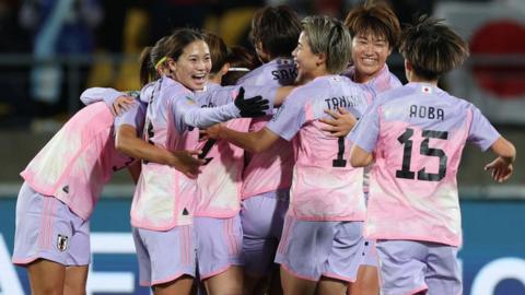 Japan players celebrate