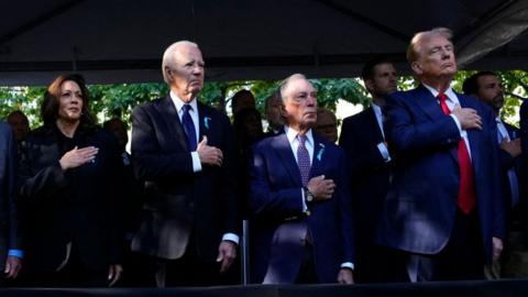 Kamala Harris, Joe Biden, former New York Mayor Michael Bloomberg and Donald Trump place their hands over their hearts during a 9/11 memorial ceremony.