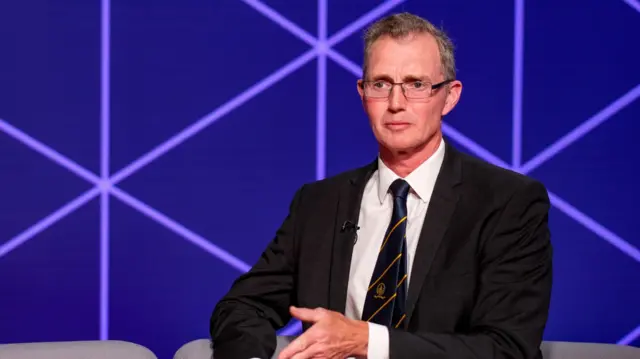 David TC Davies, the UK government's Wales secretary, in a TV studio