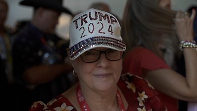 Woman wearing sparkly Trump hat