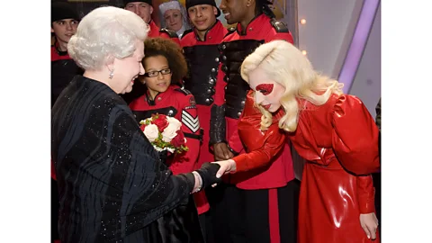 Getty Images When meeting Queen Elizabeth II at the annual Royal Variety Performance in 2009, Lady Gaga donned a floor-length red latex Atsuko Kudo dress (Credit: Getty Images)