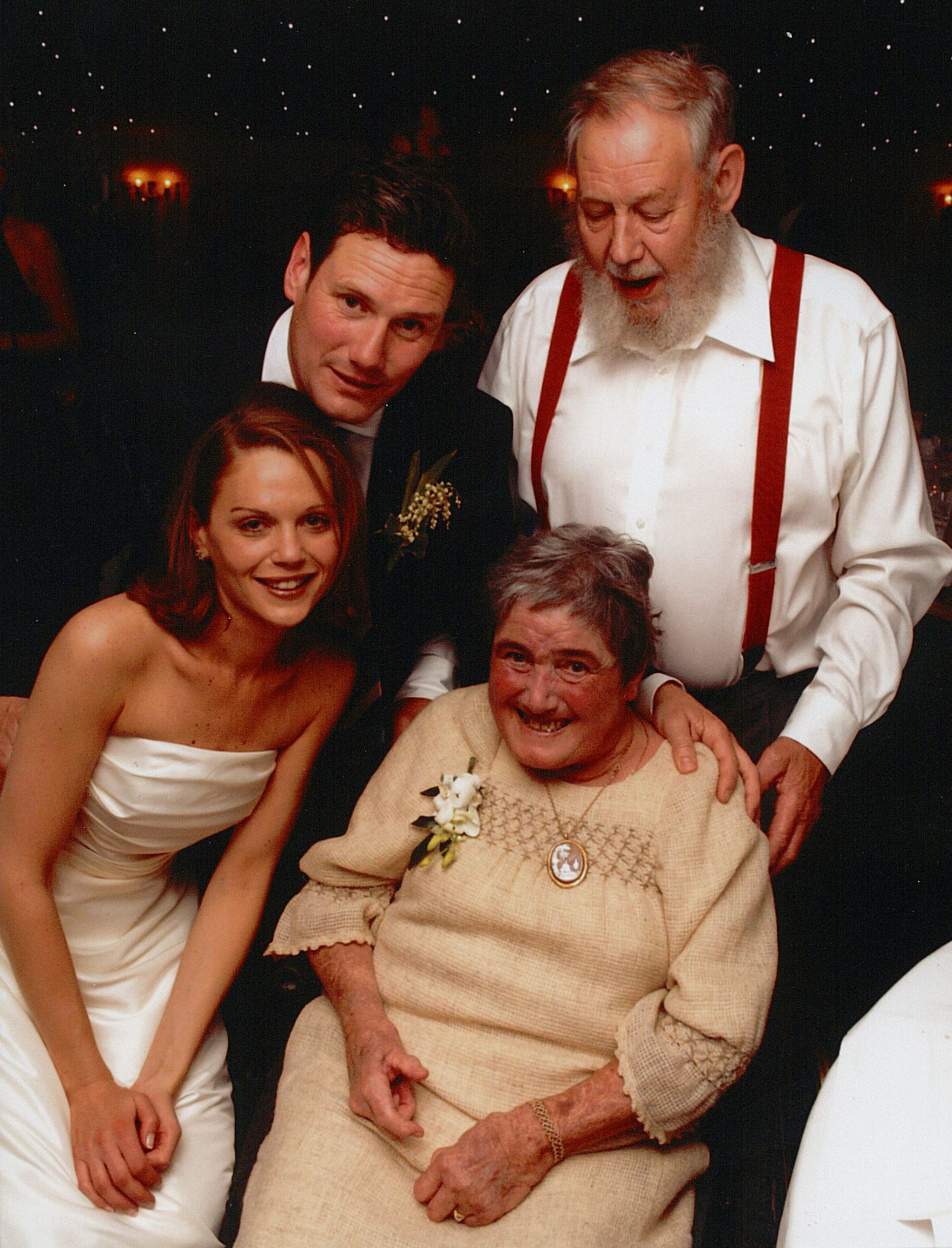 Sir Keir poses for a wedding day picture with his parents and new wife, Victoria, in 2007
