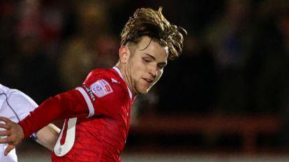 Accrington Stanley's Alex Henderson shields the ball from Bolton Wanderers' Eoin Toal during the Bristol Street Motors Trophy Third Round match between Accrington Stanley and Bolton Wanderers at Wham Stadium on January 10, 2024 in Accrington, England