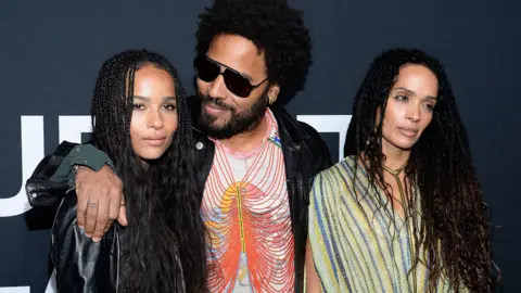 Getty Images Musician Lenny Kravitz (centre) and actresses Zoe Kravitz (L) and Lisa Bonet R)