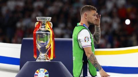 England's Kieran Trippier looks dejected as he walks past the trophy after the match