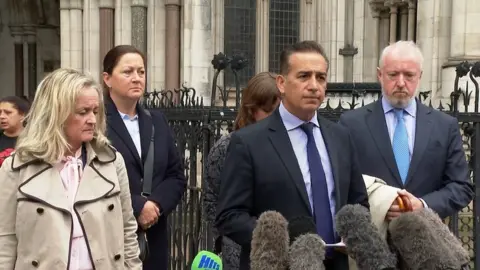 Dr Sanjoy Kumar speaks outside the steps of the Court of Appeal