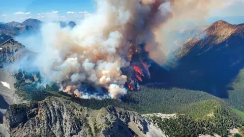 Smoke rises from the Texas Creek wildfire (K71415) south of Lillooet, British Columbia, Canada July 9, 2023. 