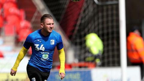 Ben Whitfield warming up for Barrow