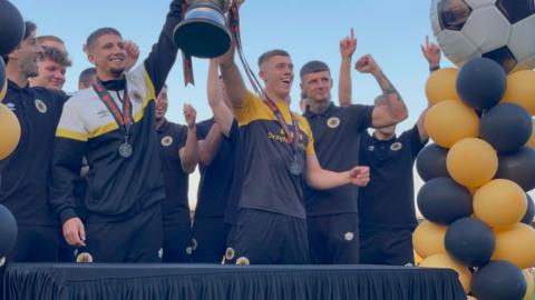 Keaton Ward and Jimmy Knowles lifting the trophy