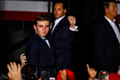 Barron Trump fist pumps at rally