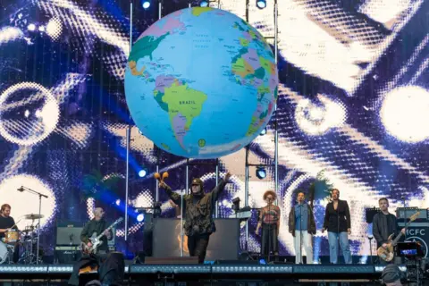 Getty Images Liam Gallagher on the TRNSMT stage in front of a giant globe