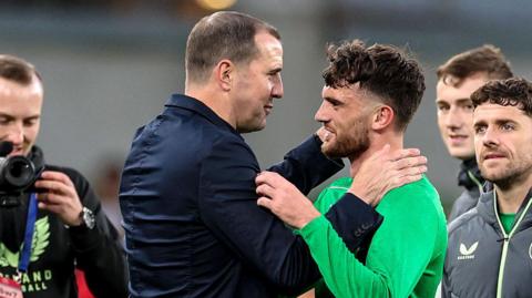 John O'Shea and Troy Parrott celebrate at full-time