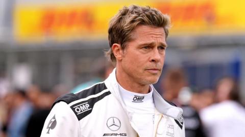 Brad Pitt in a Formula 1 racing suit