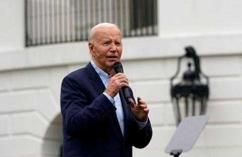 U.S. President Joe Biden speaks during a July Fourth barbecue for active-duty U.S. military members and their families at the White House in Washington, U.S., July 4, 2024.