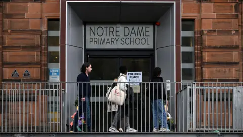 PA Media Voters go into Notre Dame primary school to vote in the 2024 general election