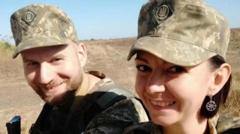 Andriy and Valeria in military uniform