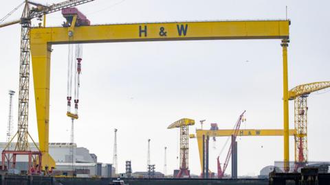 The famous yellow Harland and Wolff cranes set against a grey cloudy sky