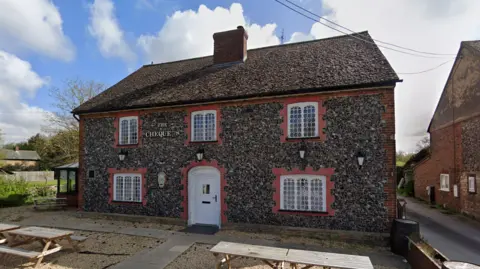 The outside of The Chequers - a village pub - in the Street, Eriswell