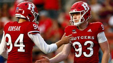 Jude McAtamney of the Rutgers Scarlet Knights is congratulated by team-mate Adam Korsak 