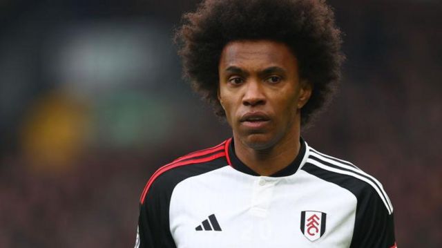 Willian looks on while in action for Fulham