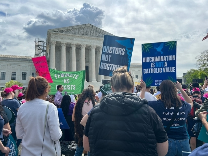 Protesters gather outside the U.S. Supreme Court while it heard arguments on an abortion-related case