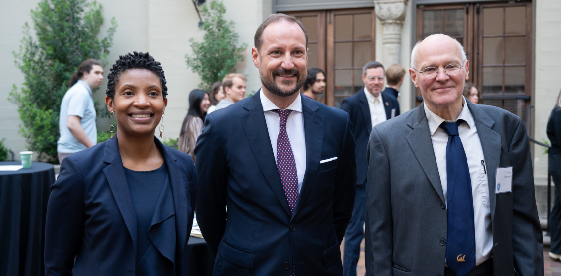 Crown Prince Haakon stands at podium