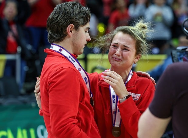 Katie Rolfes, daughter of Incarnate Word Academy head coach Dan Rolfes, gets emotional after receiving a championship medal following a win in Missouri's Class 6 girls basketball state championship game. Dan Rolfes suffered a heart attack and was hospitalized after a semifinal win but the team perservered through a traumatic situation to win the title. (Photo: David Smith)