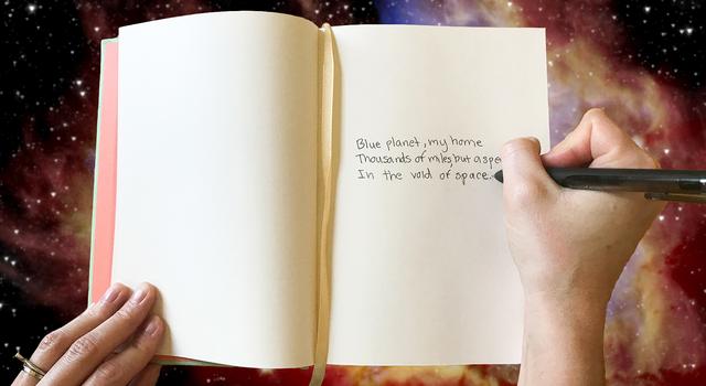 A person writes a poem about Earth in a journal.