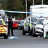 Agentes de policía y personal forense se encuentran detrás de un cordón en Hart Street en Southport, noroeste de Inglaterra, el 29 de julio de 2024, tras un ataque con cuchillo que causó la muerte de dos menores.