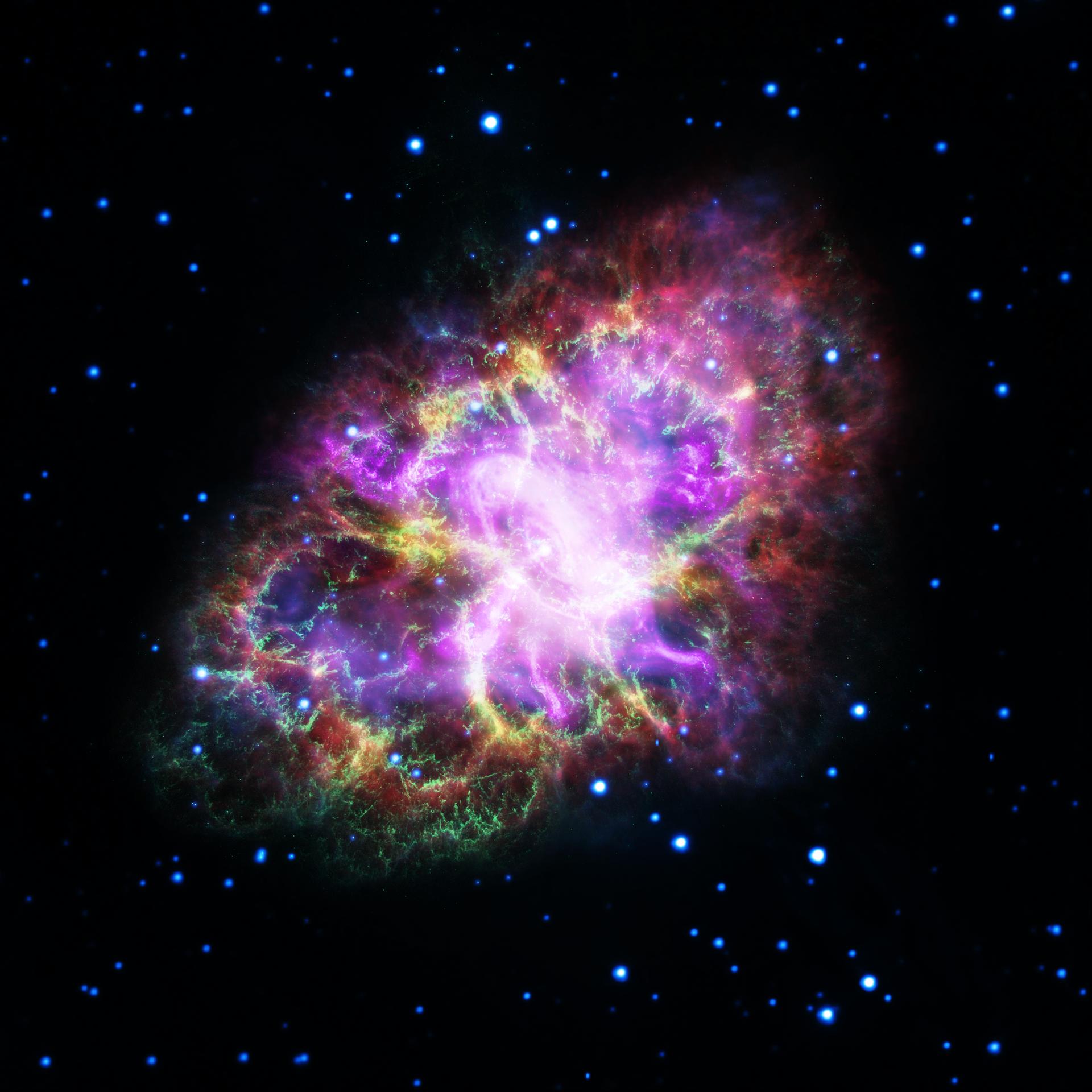 A bright white center is encircled with pinks, purples and yellow colors with a black background dotted with white and blue stars.