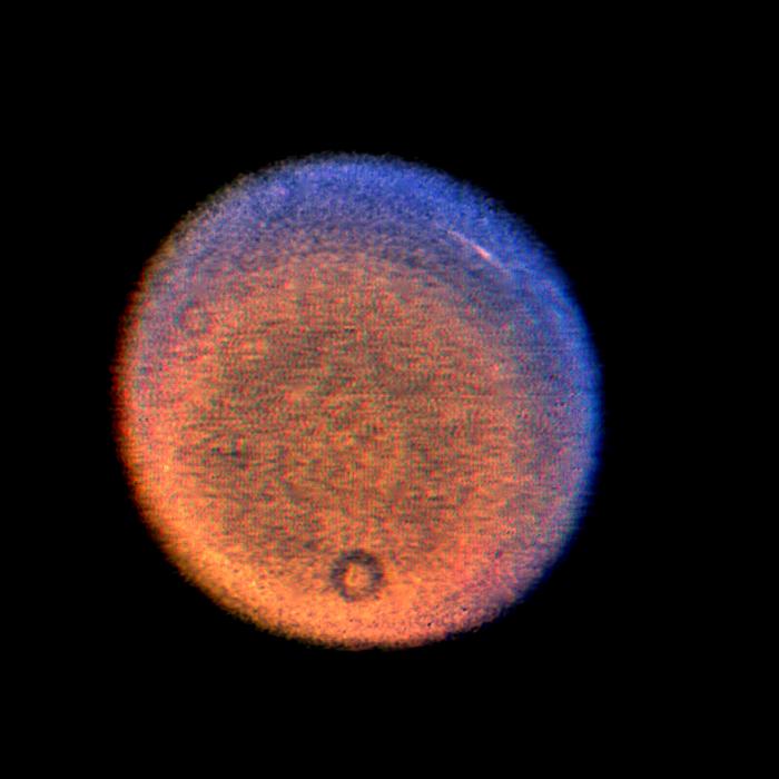 This false-color picture of Uranus, obtained by NASA Voyager on Jan. 14, 1986, shows a discrete cloud seen as a bright streak near the planet limb.